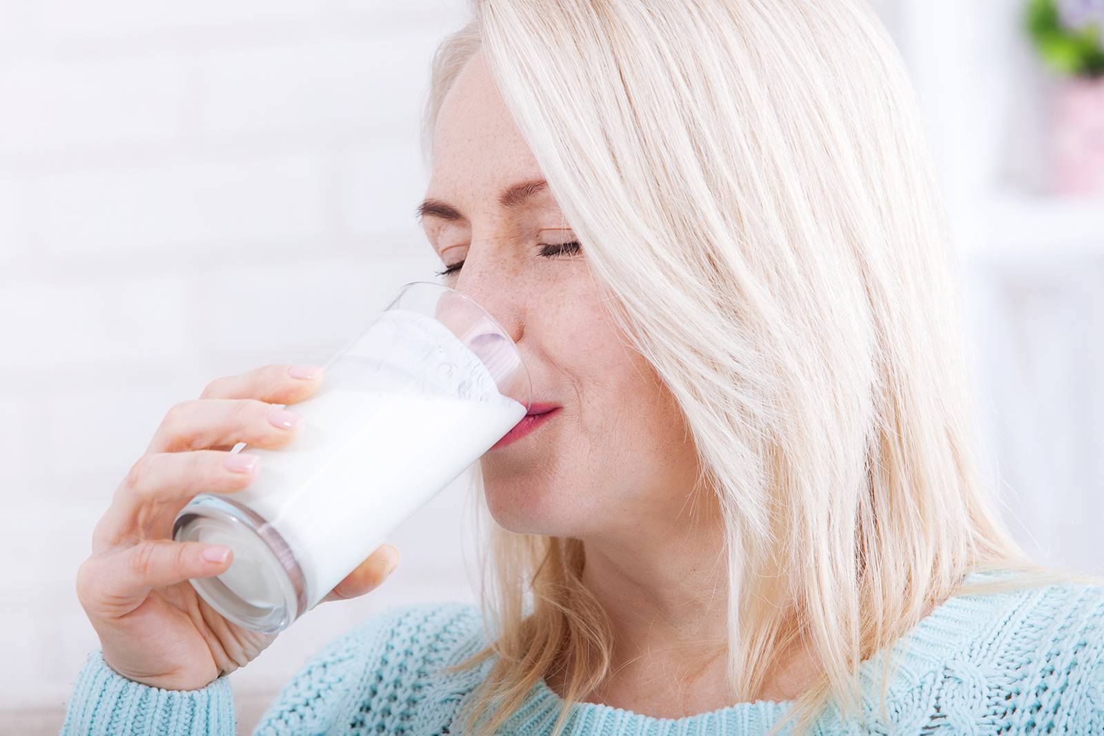 Woman drinking milk from a glass