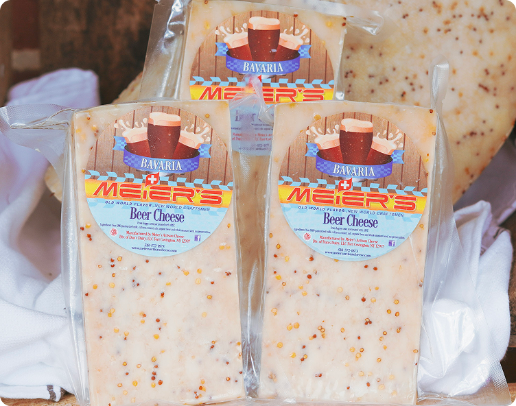 Packaged beer cheese blocks on display