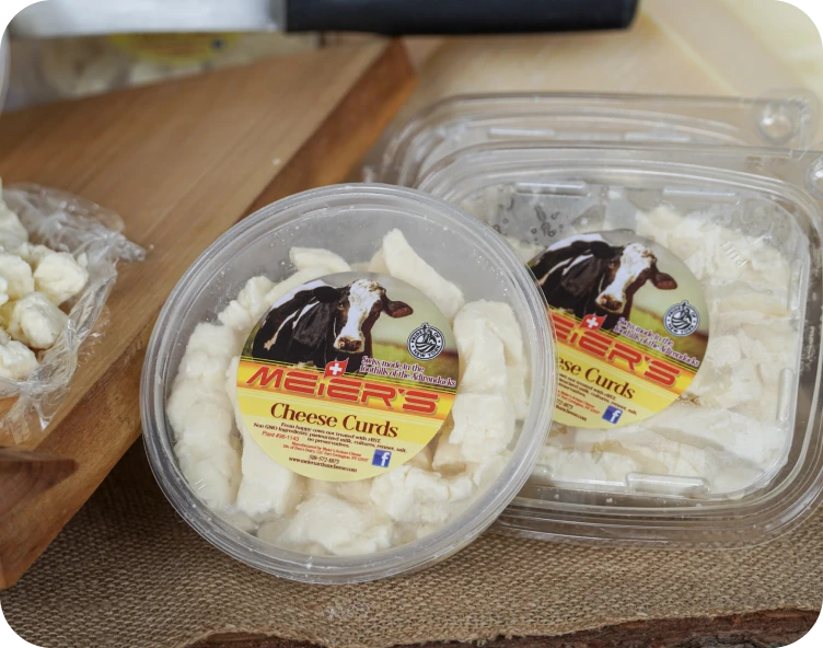 Packaged cheese curds with cow label
