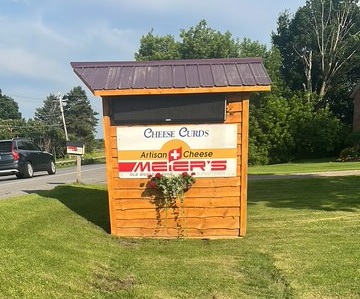 Small wooden sign for Meier's artisan cheese